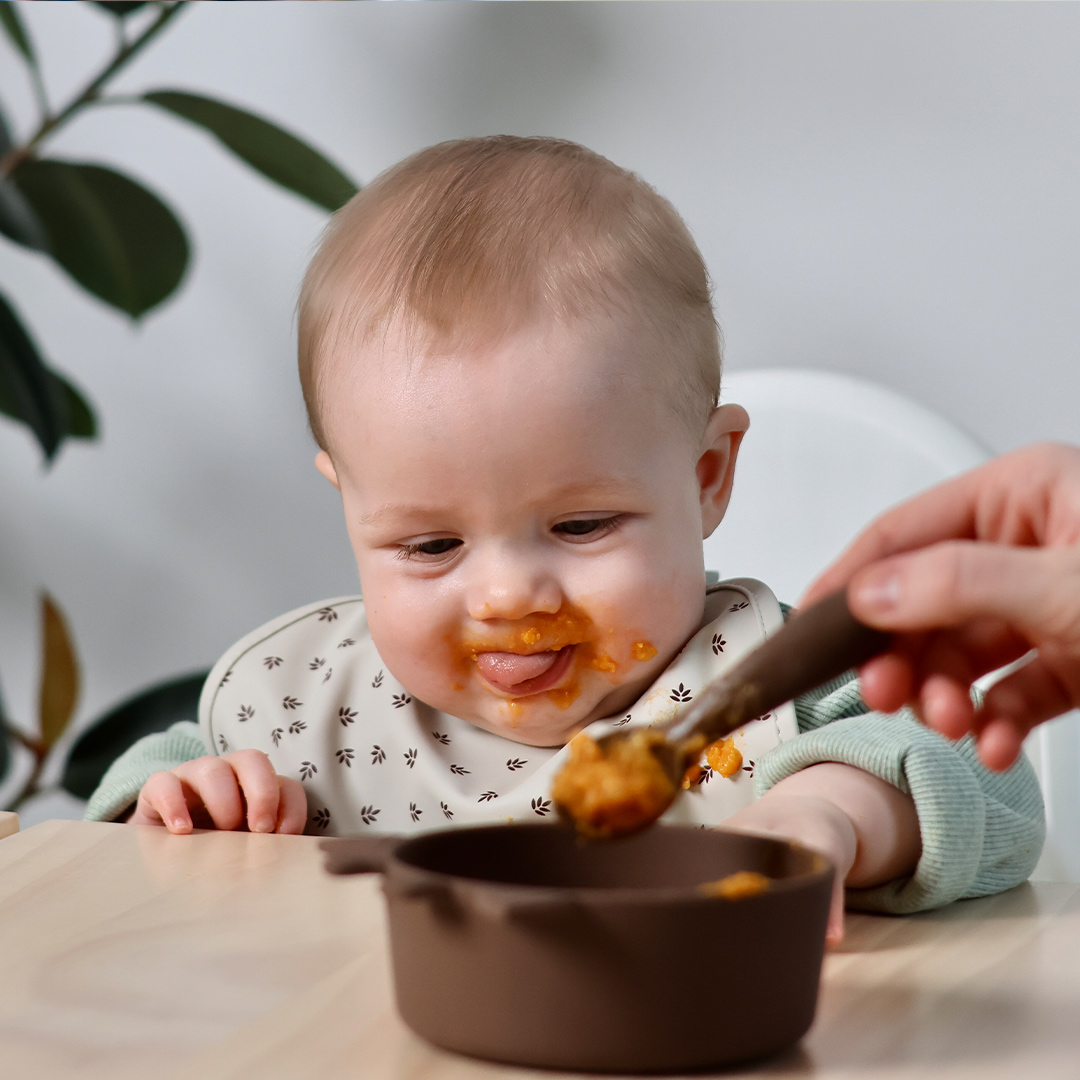 Baby being fed